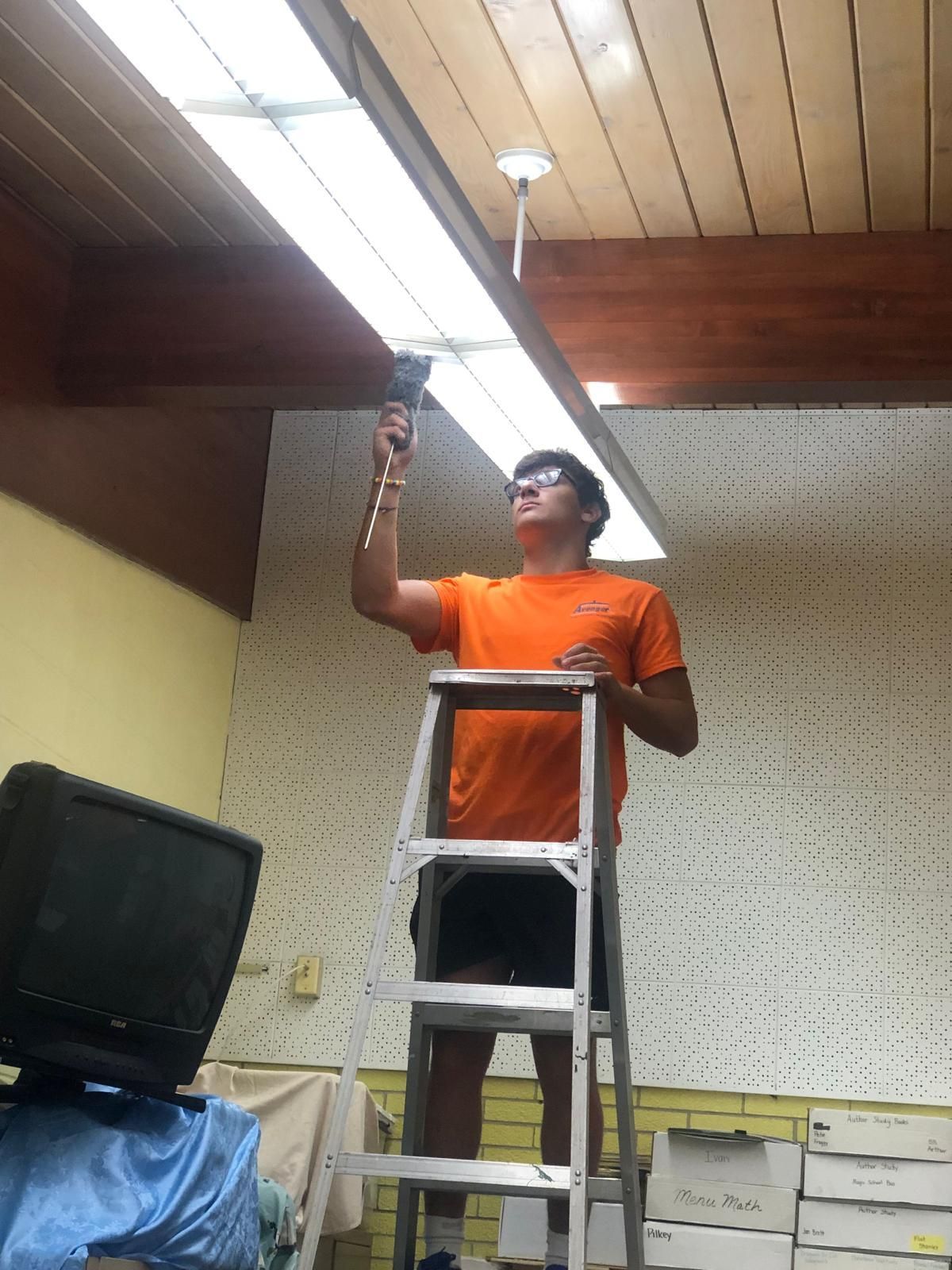 Person performing home remodeling near me in Cleveland, OH using a drill