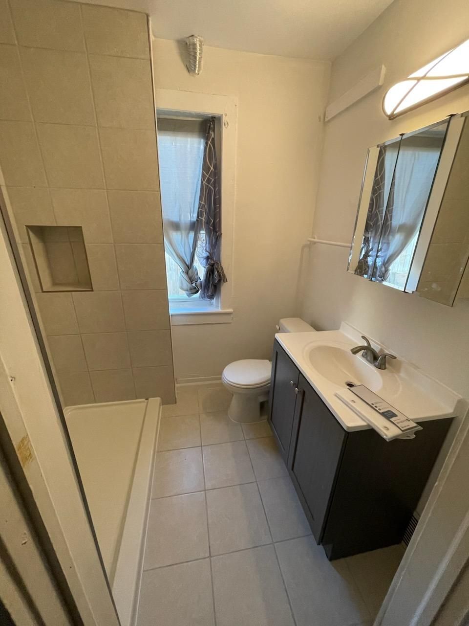 Kitchen remodeling project near me in Cleveland, OH with vacuum cleaner on the floor