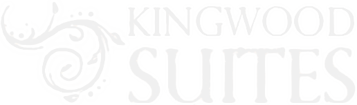 Pale gray &ldquo;Kingwood Suites&rdquo; logo with decorative swirls on a white background