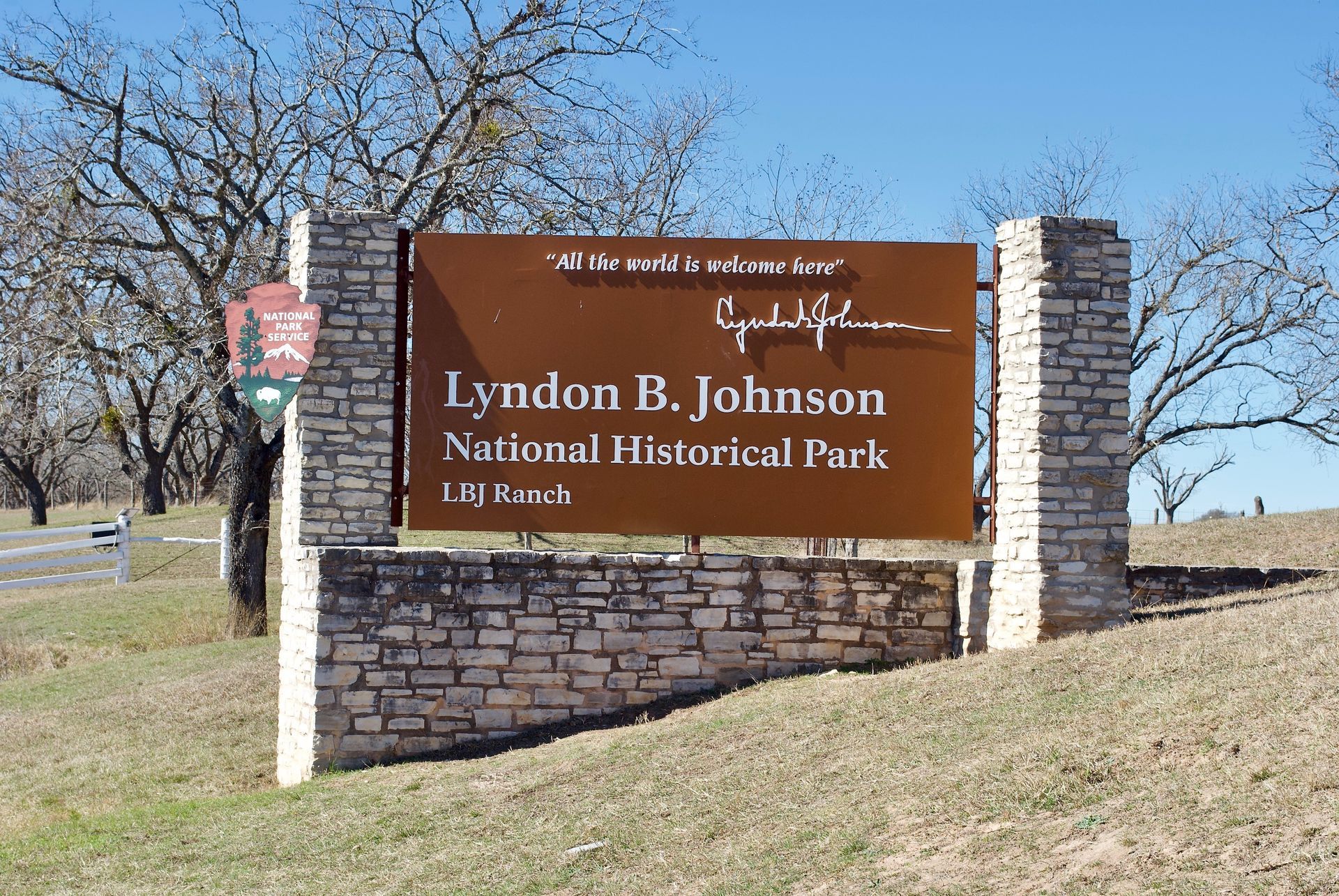 Brown sign for Lyndon B. Johnson National Historical Park in a grassy roadside area