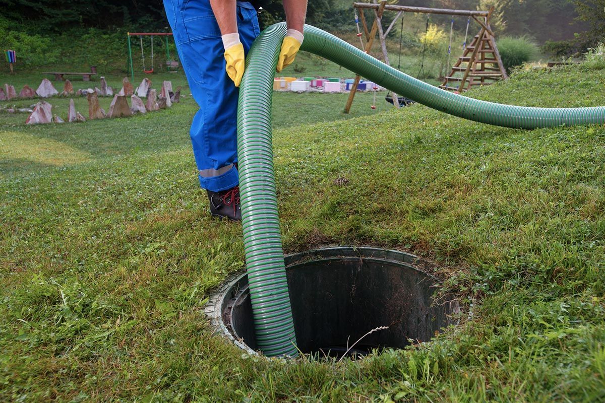 a person cleaning a septic