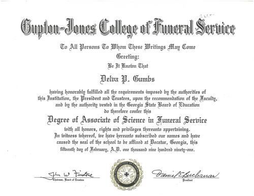 Framed diploma certificate with ornate black text, seals, and signatures on a white background