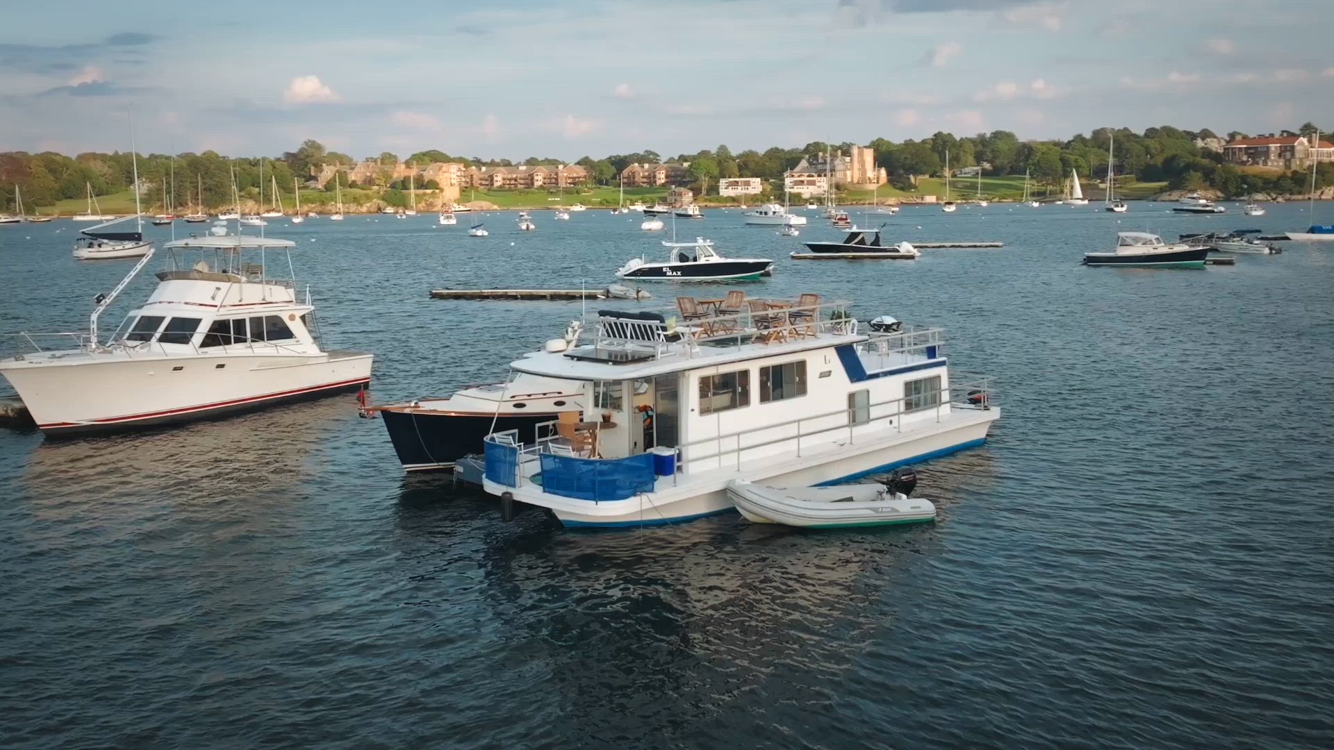 The houseboat at anchor in the middle of Newport Harbor