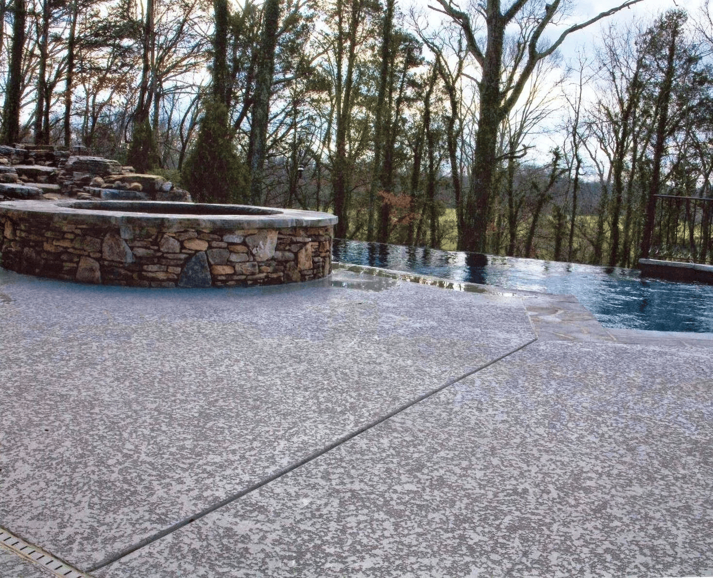 Decorative concrete overlay around a swimming pool
