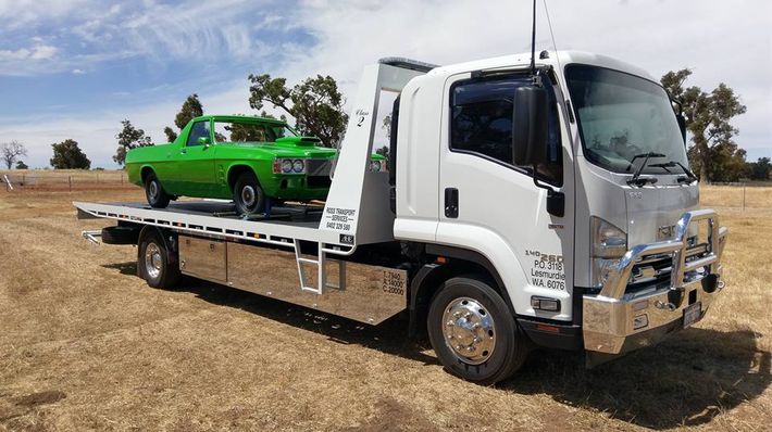 green colour car being transported