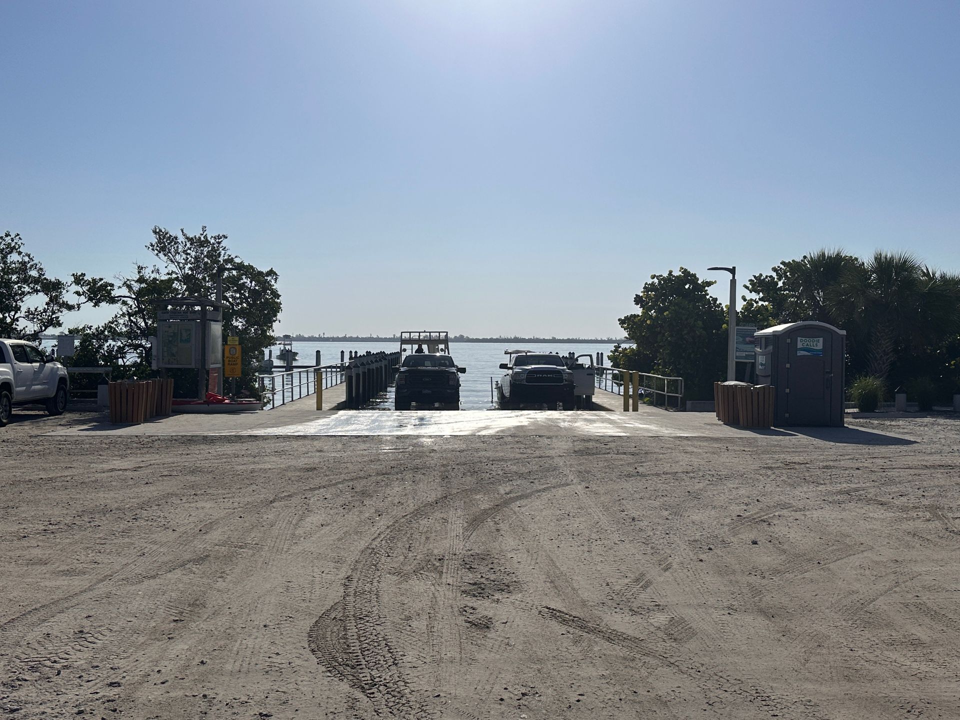 A parked boat rests at the end of a dock