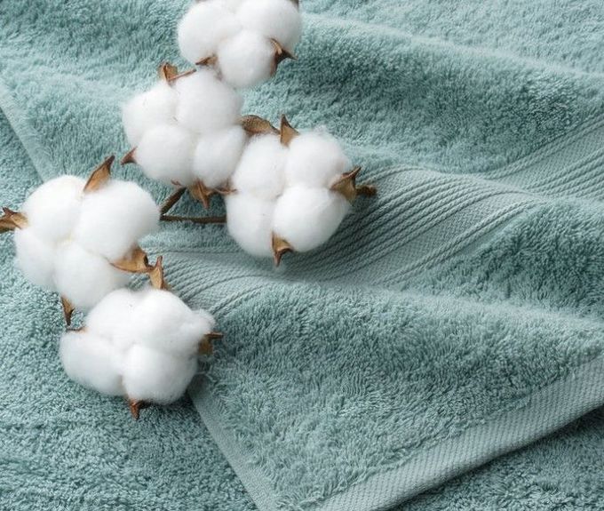 A Close up Of a Towel with Cotton Flowers on It — Sew Affordable In Charmhaven, NSW