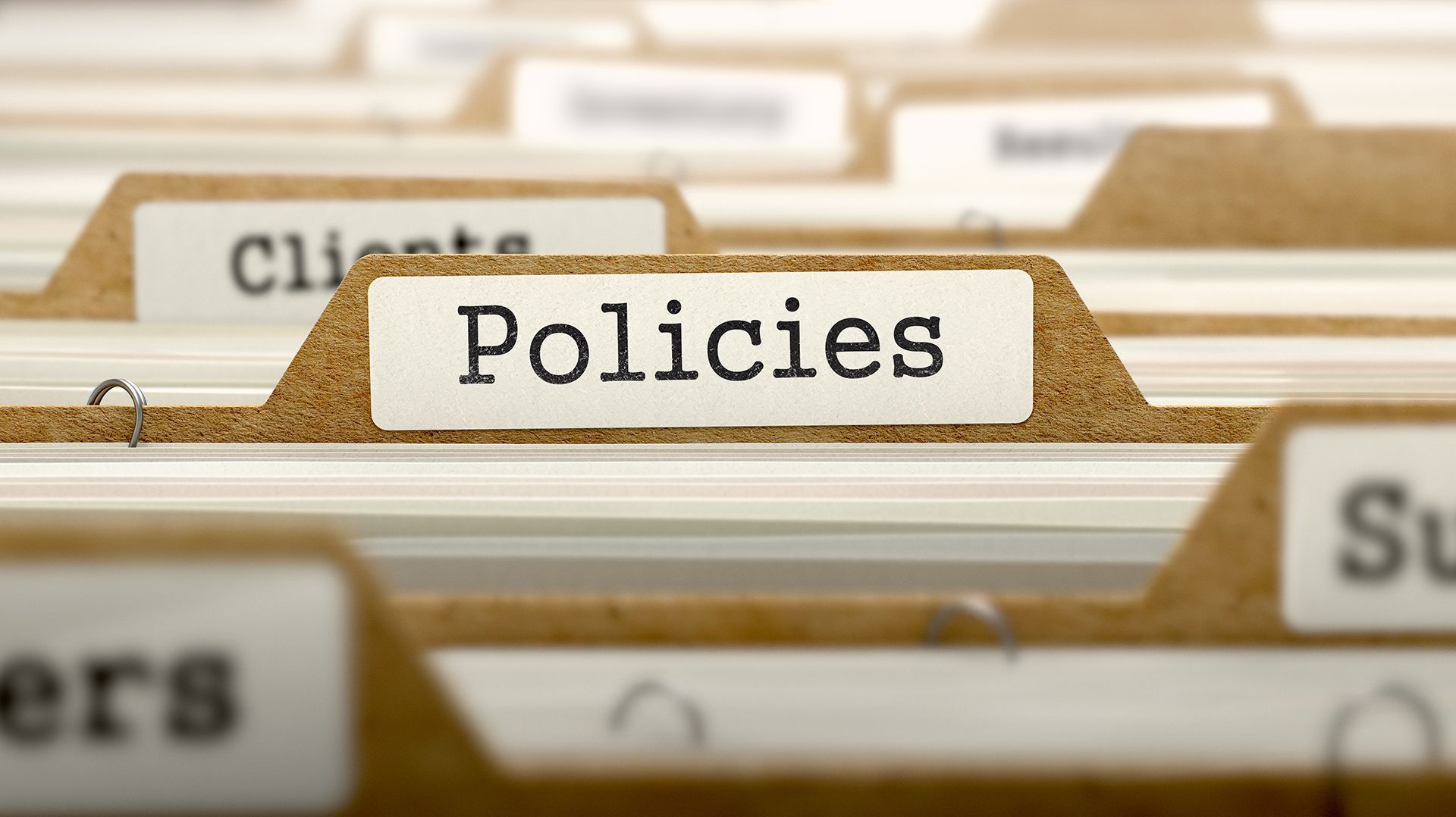 A folder with the word policies written on it