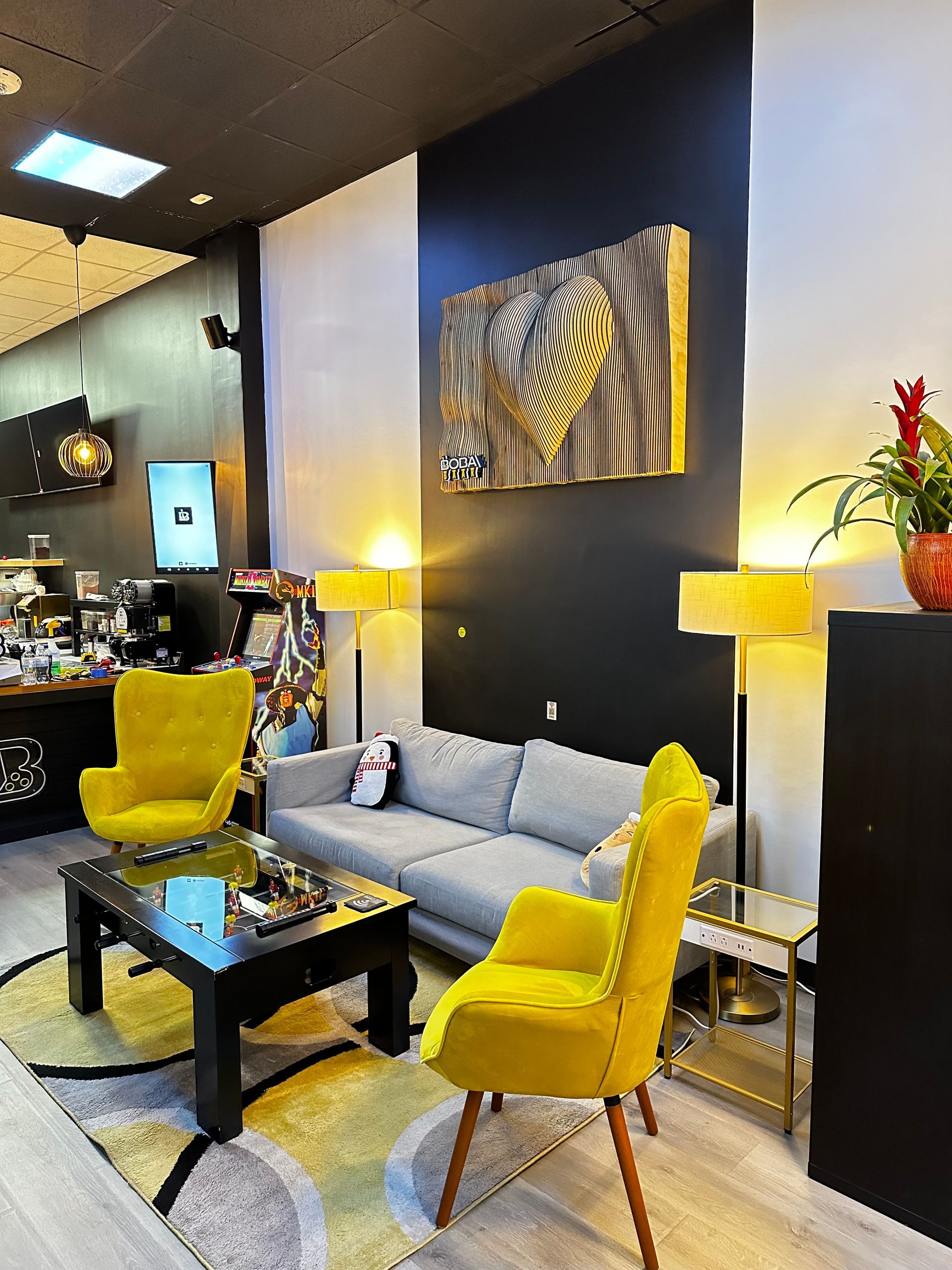 A living room with yellow chairs and a couch