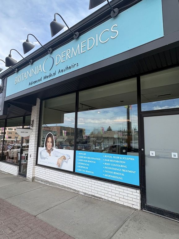 Britannia Dermedics storefront with blue signage and large windows on a sidewalk