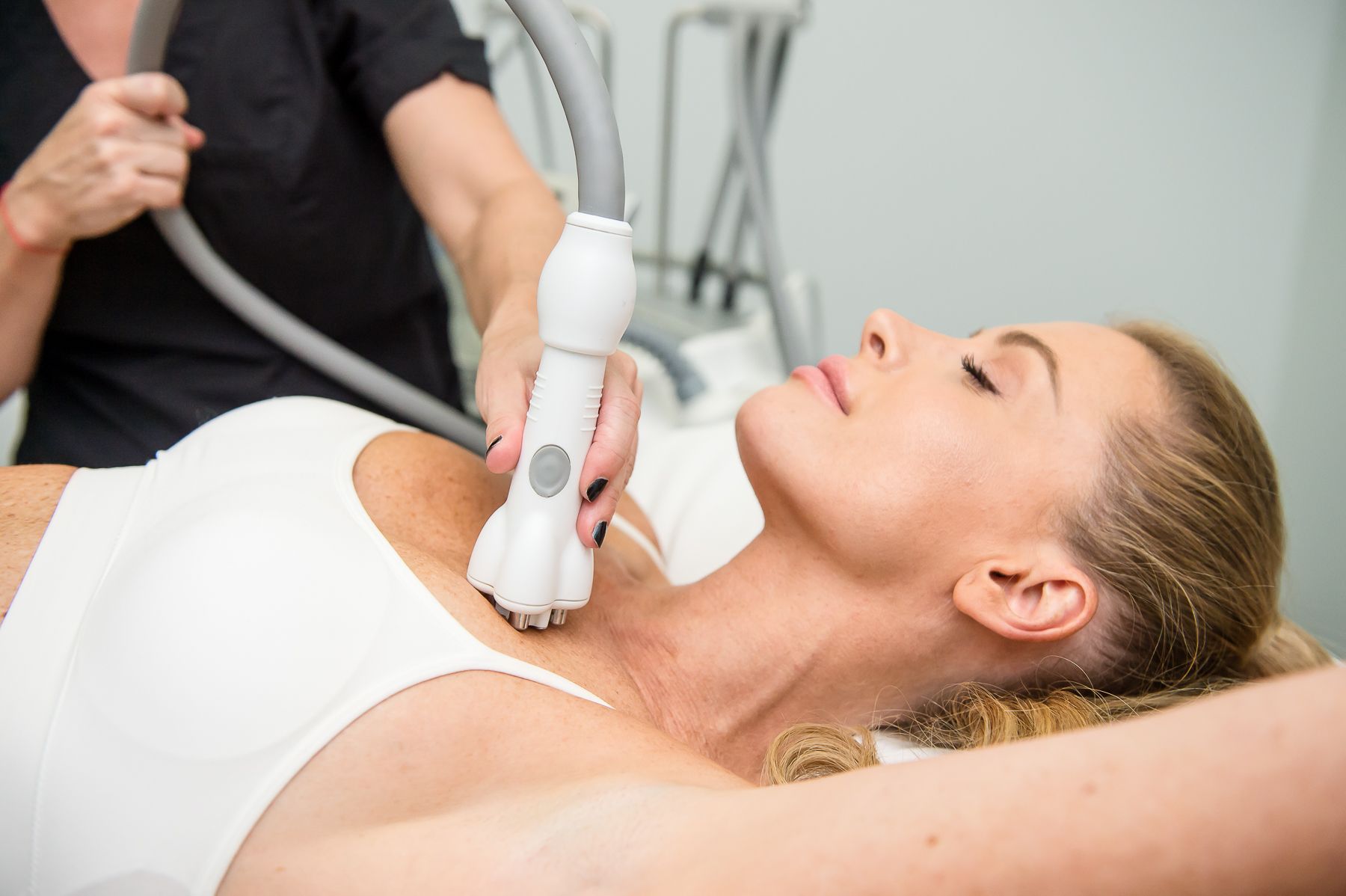 A woman is getting a facial treatment in a beauty salon.
