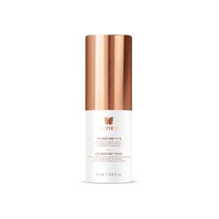Copper and white cosmetic bottle with a metallic cap on a white background