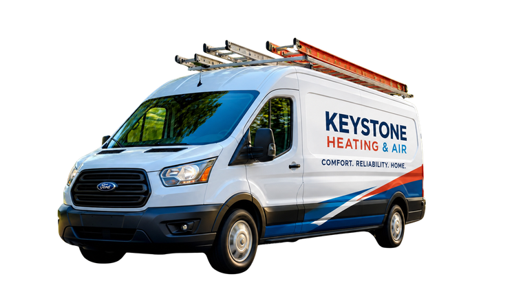 White Keystone Heating & Air service van with roof ladders on a white background