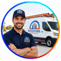 Blue-uniformed technician with utility van, logo, and ladders in a circular red-and-blue frame