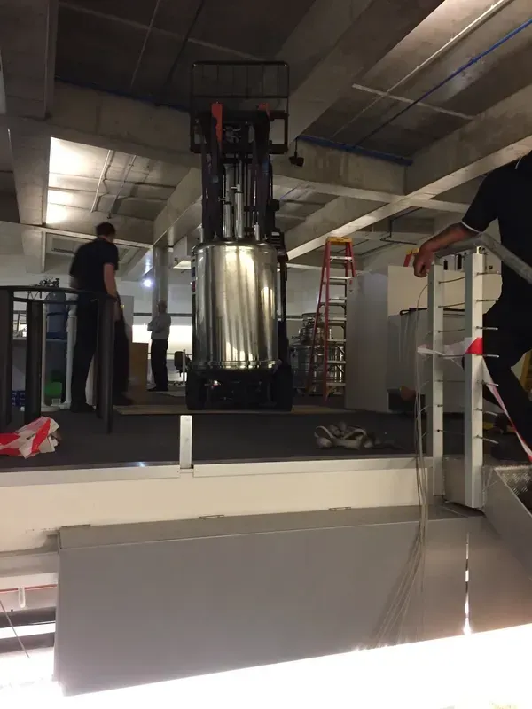 Forklift lifting a tank to a new building | Derrimut, VIC | Discount Forklifts