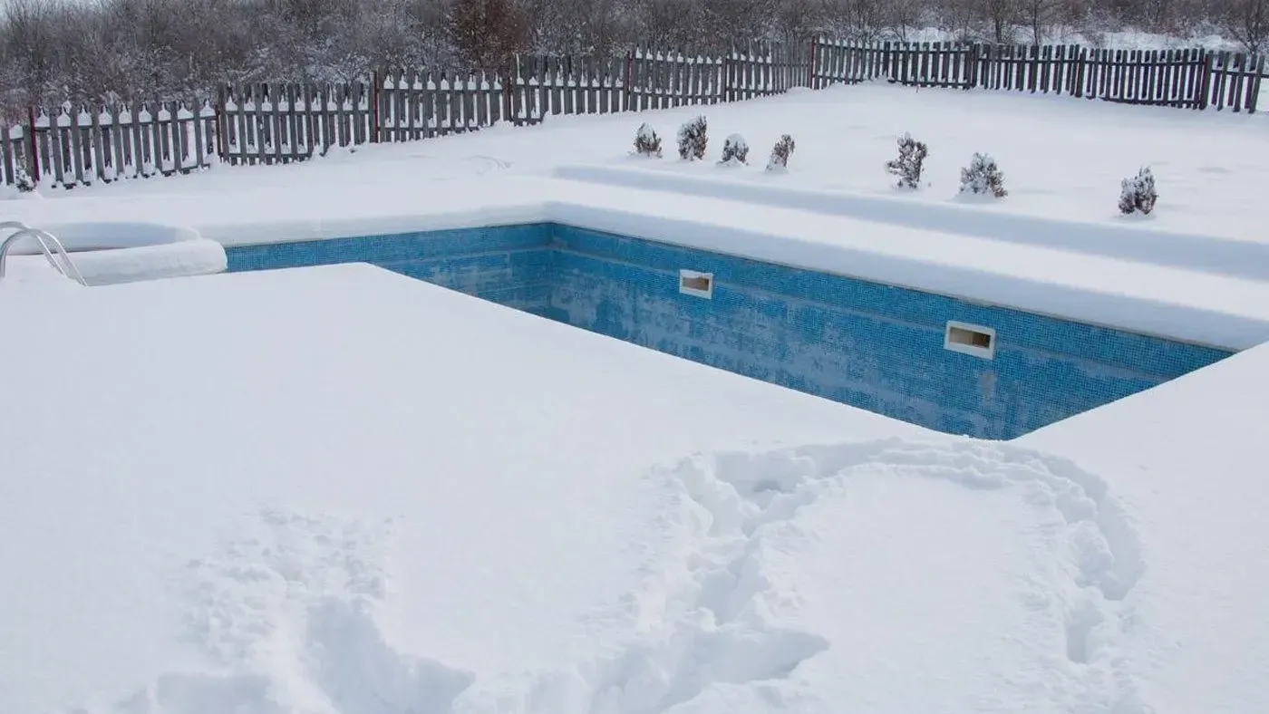 Swimming Pool Surrounded by Snow
