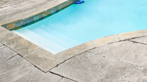 A close-up image of a natural stone patio with unique patterns and textures.