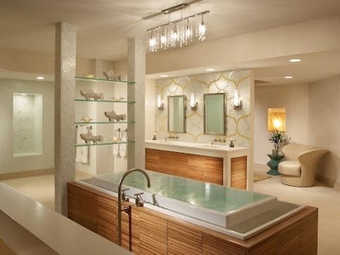 Luxurious spa bathroom with freestanding tub, dual sinks, mirrors, and warm lighting