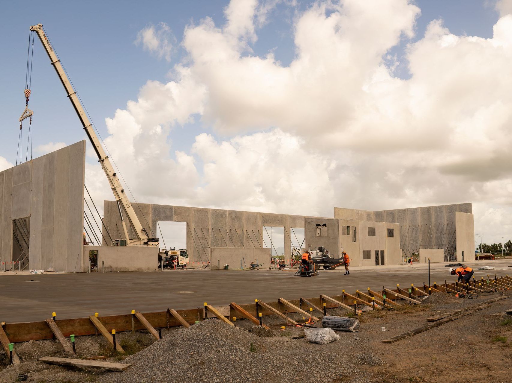 A large building is being built with a crane.