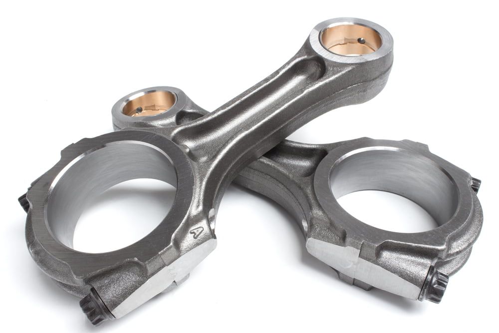 Two Connecting Rods Are Stacked on Top of Each Other — Curtin Engine Reconditioning Pty Ltd In Paget, QLD