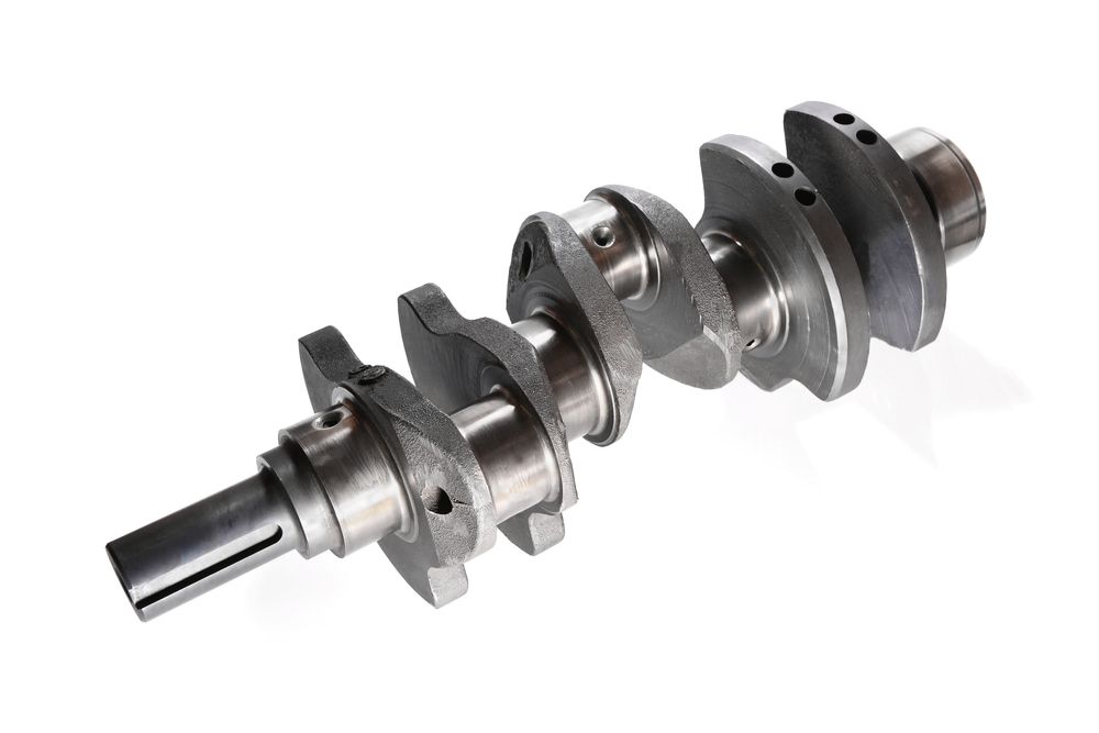 A Close Up of a Crankshaft on a White Background — Curtin Engine Reconditioning Pty Ltd In Paget, QLD
