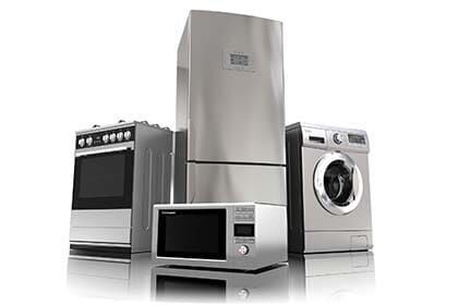 A group of stainless steel appliances including a refrigerator , microwave , washer and dryer.