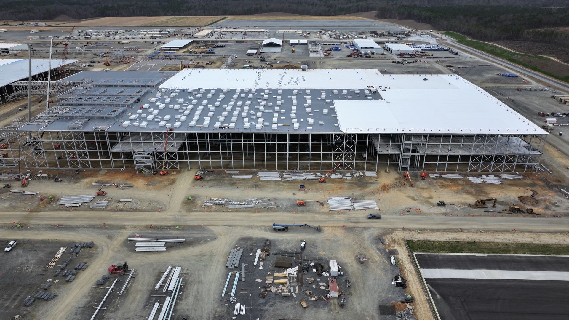 An aerial view of a large building under construction