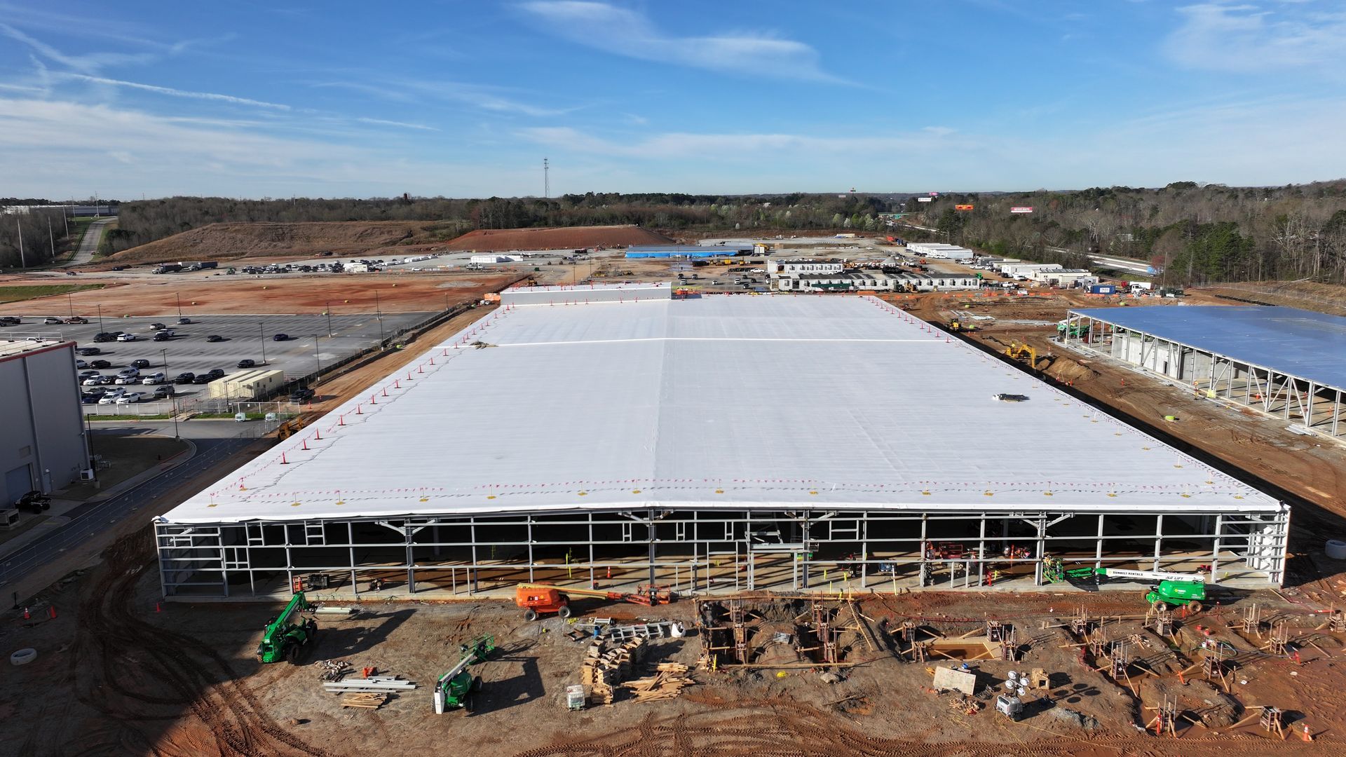 An aerial view of a large building under construction.