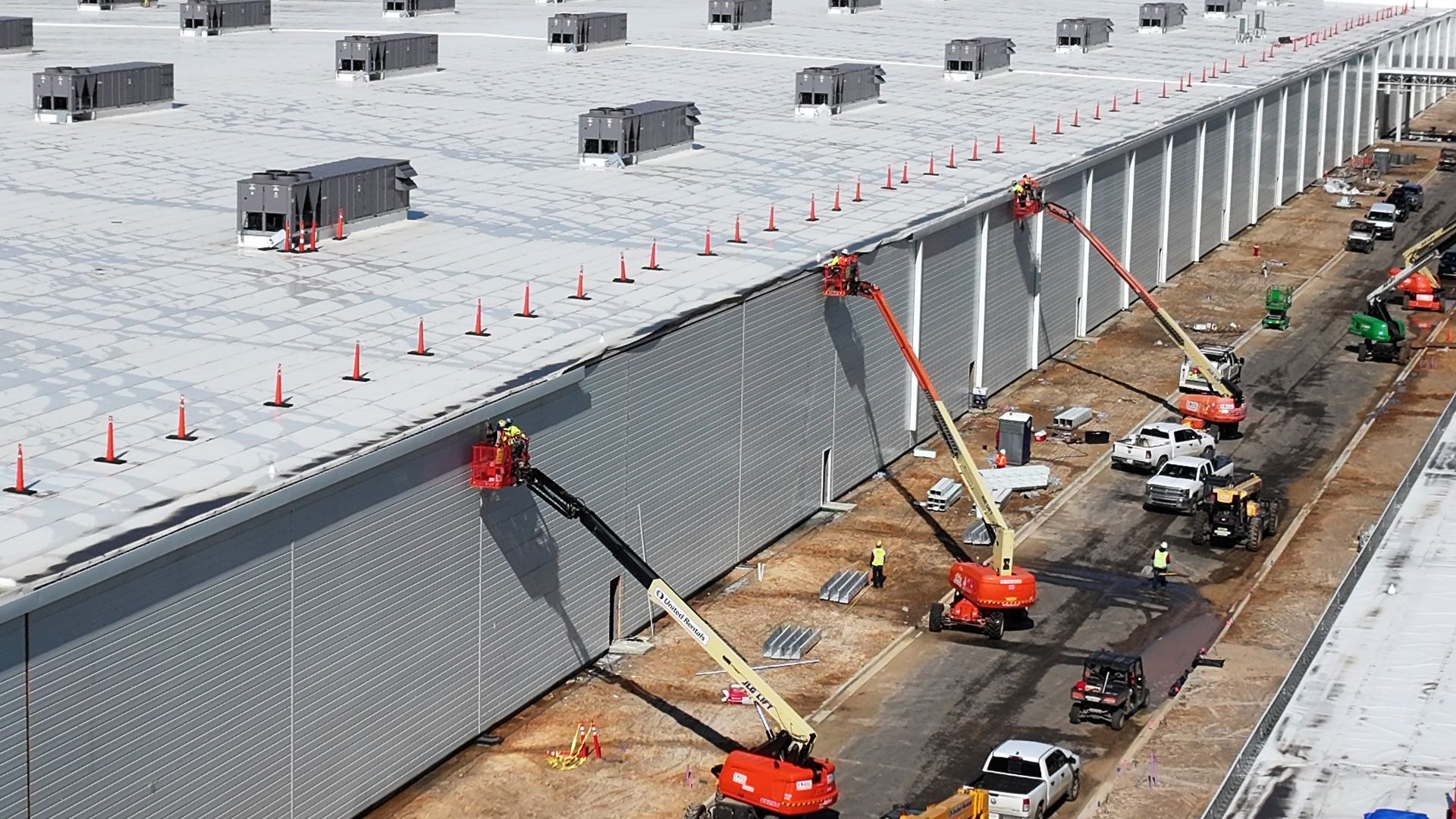 An aerial view of a large building under construction.