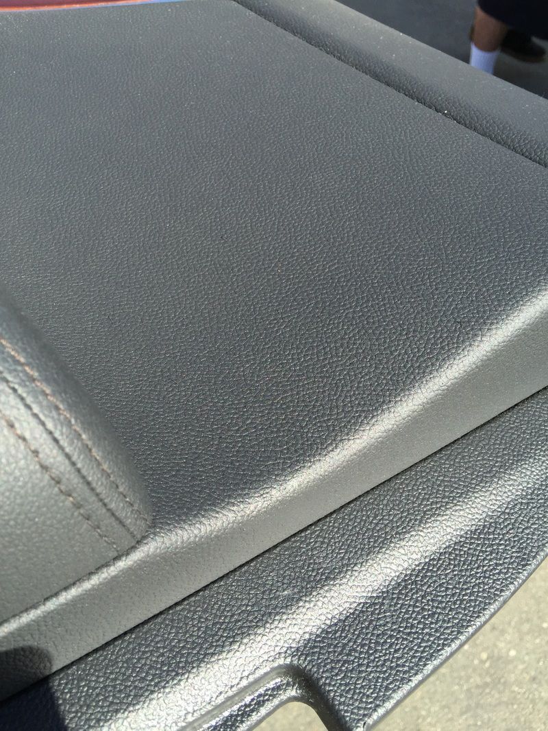 Close-up of gray textured car seat upholstery and stitching