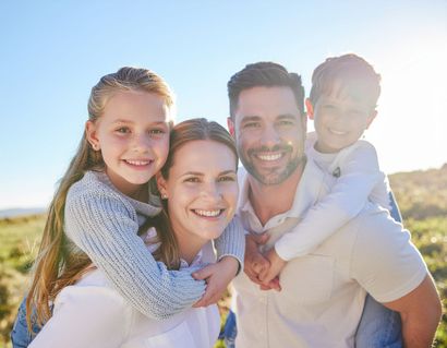 Smiling family outdoors