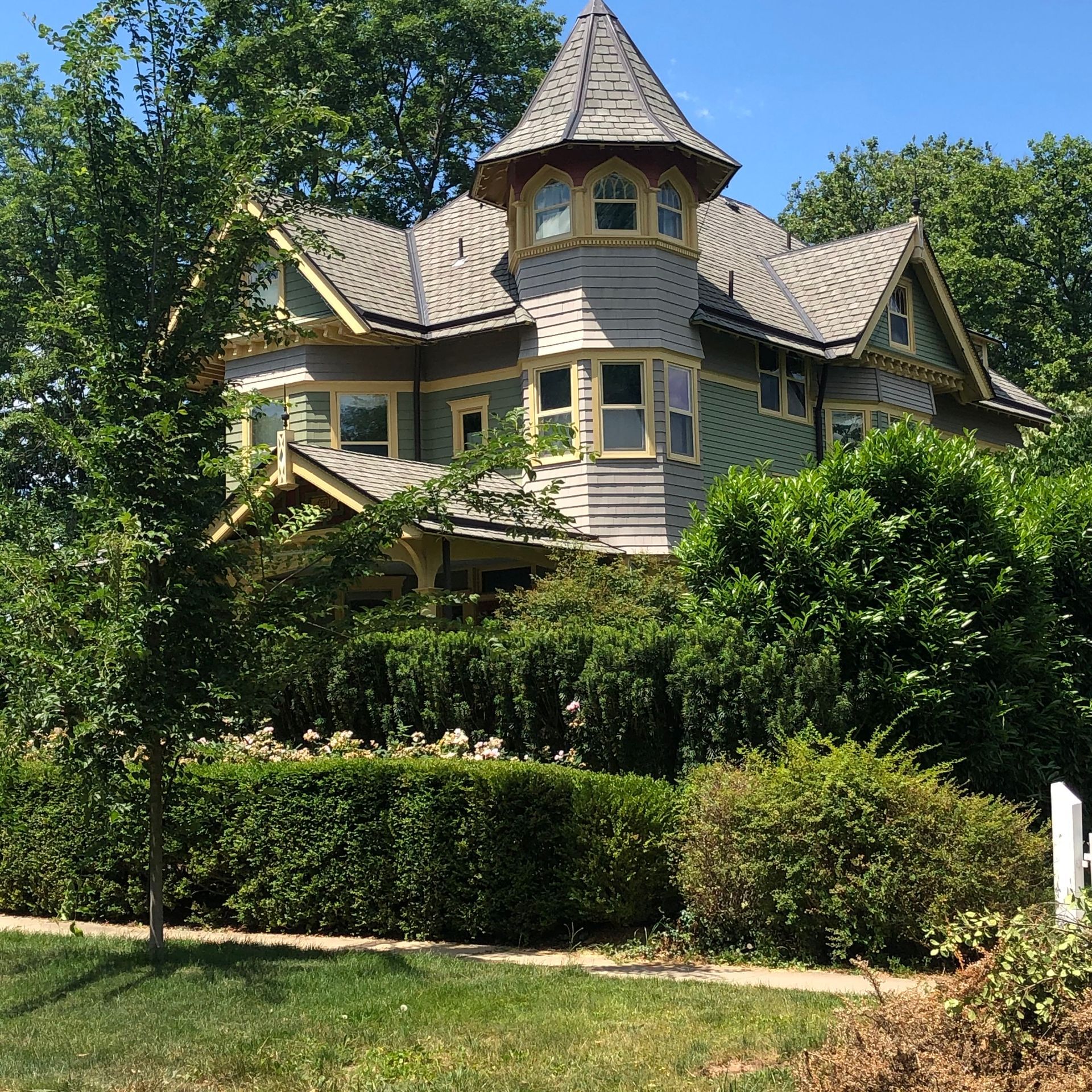 A large house with a tower on top of it