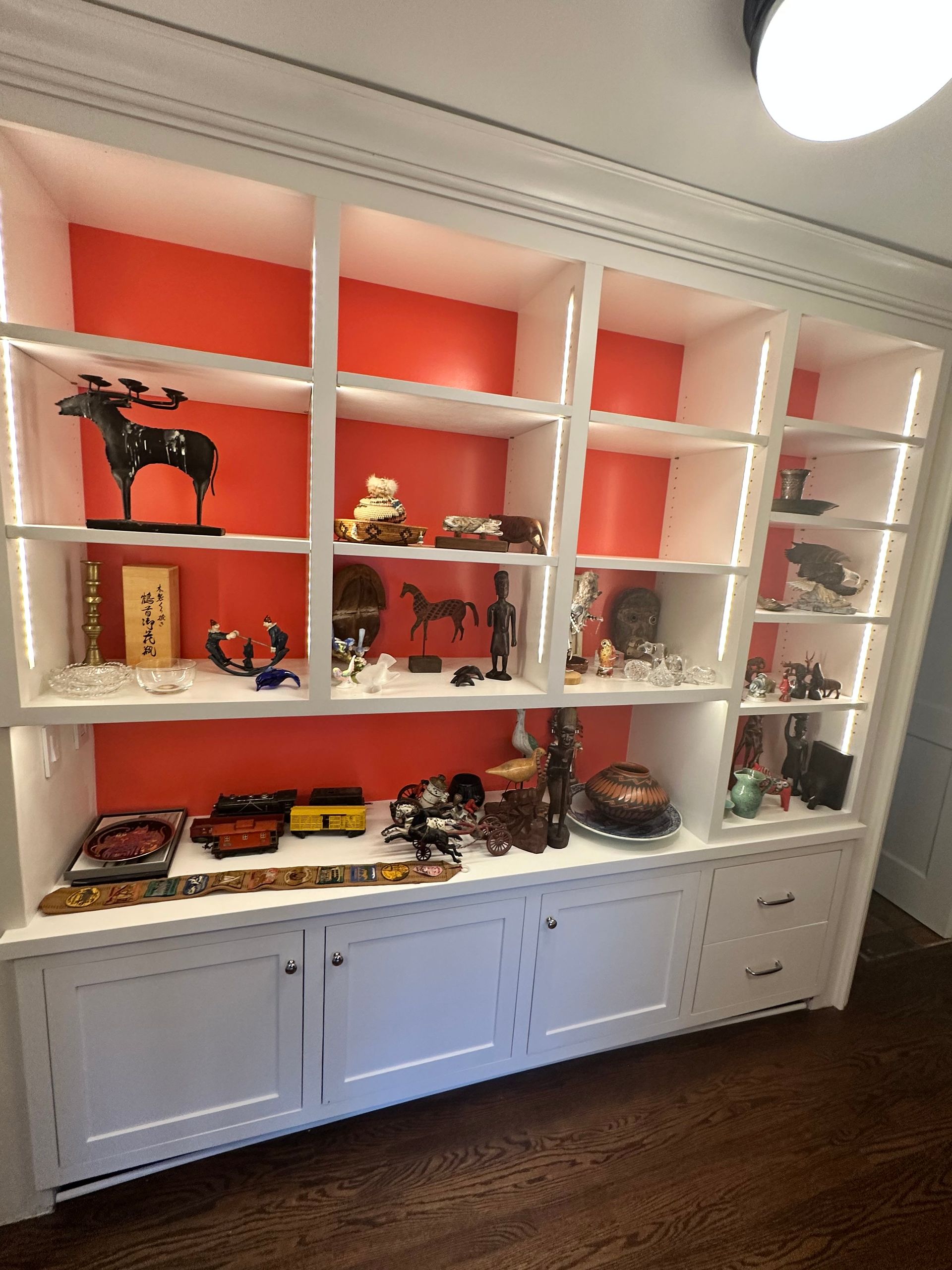 A bookshelf filled with lots of objects and decorations