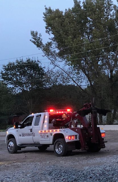 tow truck with lights on at night