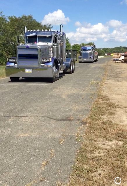 tow truck on the road in summer