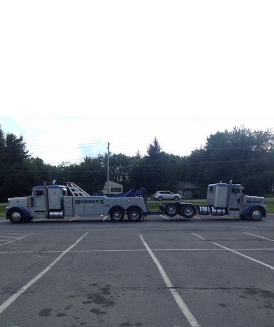 Murray's tow truck towing another truck