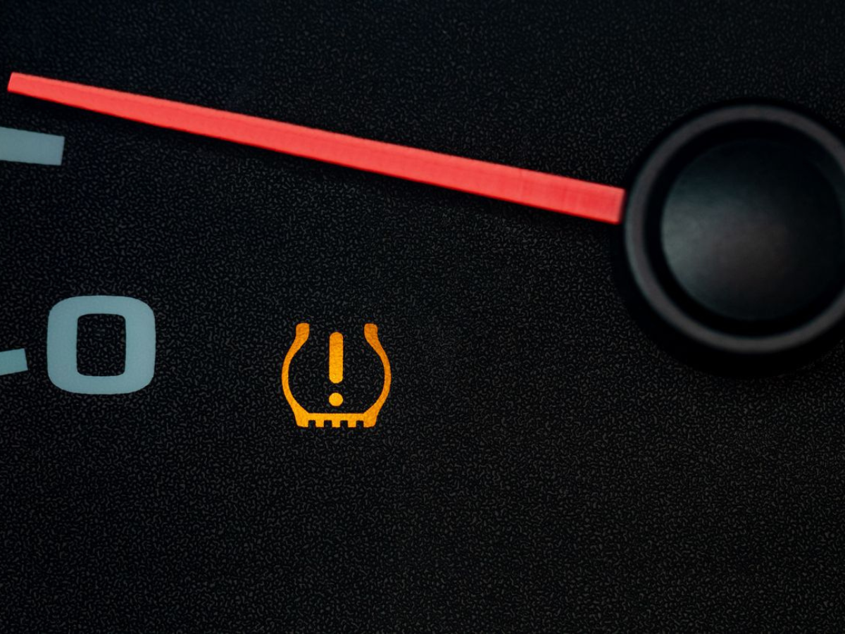 A close up of a tire pressure gauge on a car A close up of a tire pressure gauge on a car