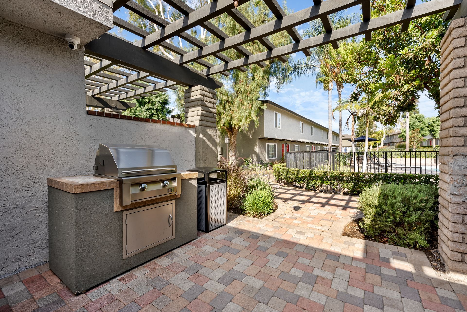 bbq grill and garbage can