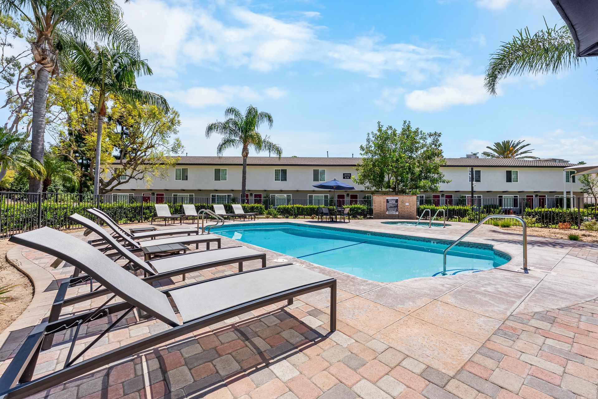 swimming pool with lounge chairs
