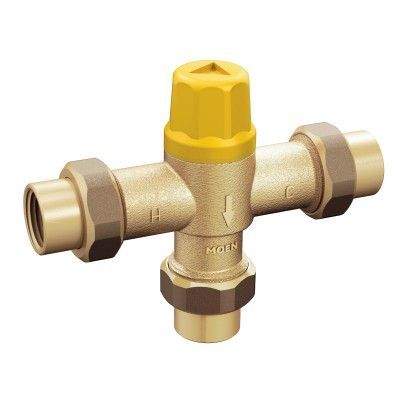A close up of a brass valve with a yellow cap