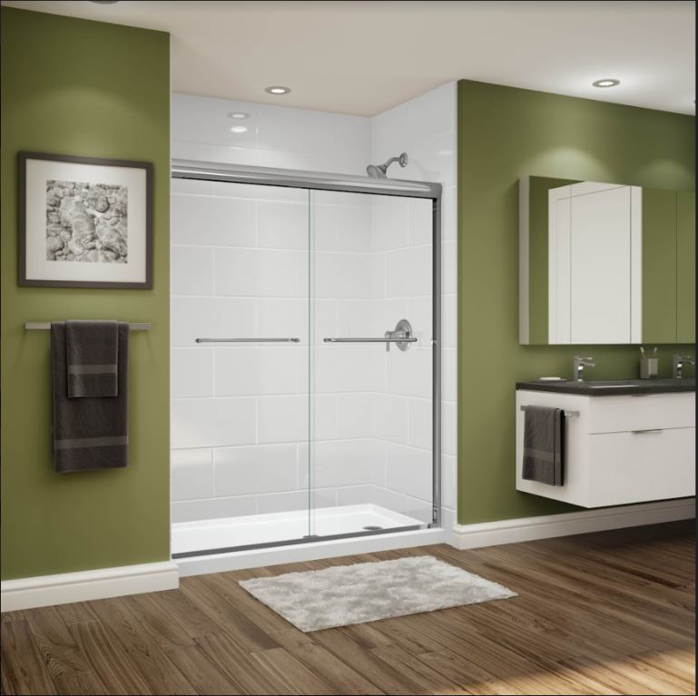 A bathroom with a sliding glass shower door