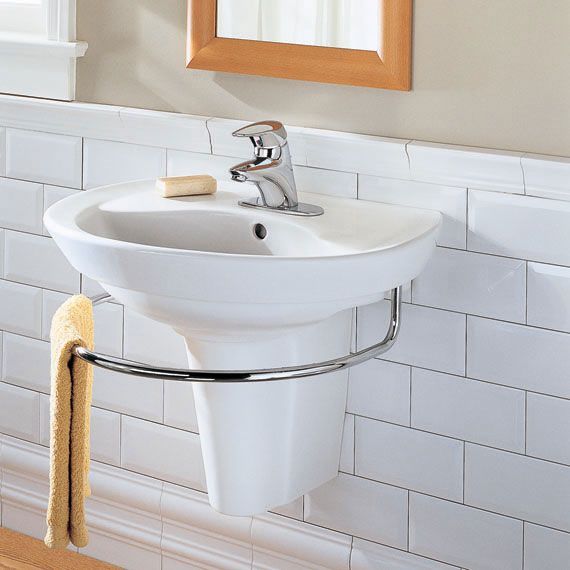 A bathroom sink with a mirror above it