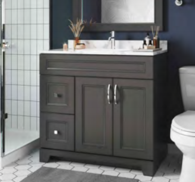 A bathroom with a sink , toilet and mirror