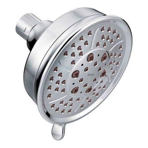A close up of a chrome shower head on a white background