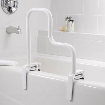 A white bathtub with a handle on the side of it.