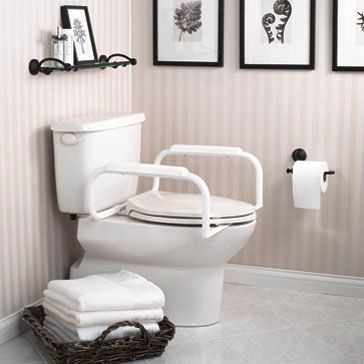 A bathroom with a toilet and a basket of towels.