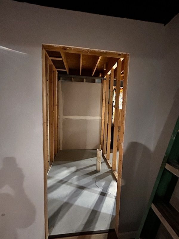 A bathtub is sitting in a bathroom under construction.