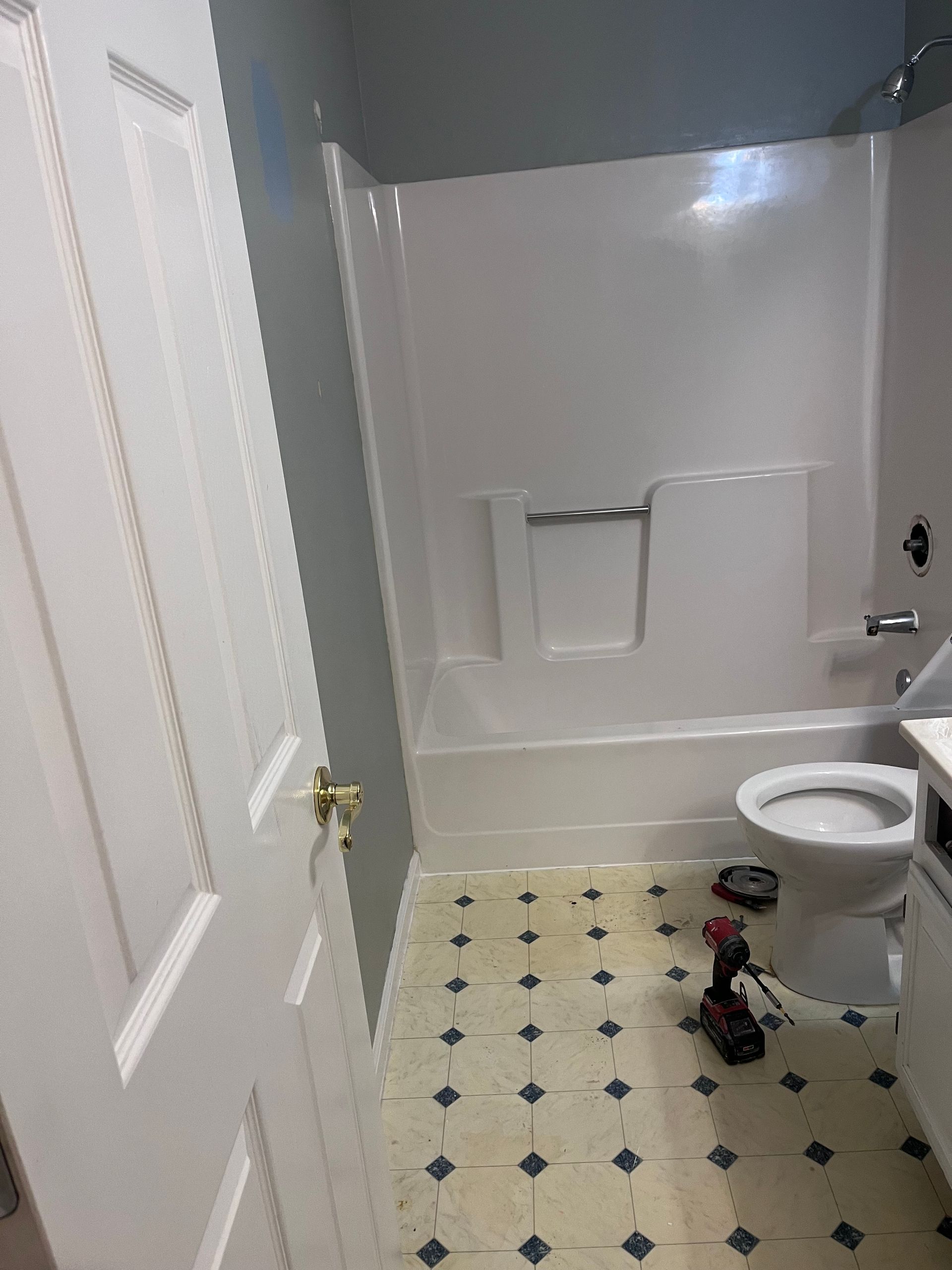 A bathtub is sitting in a bathroom under construction.