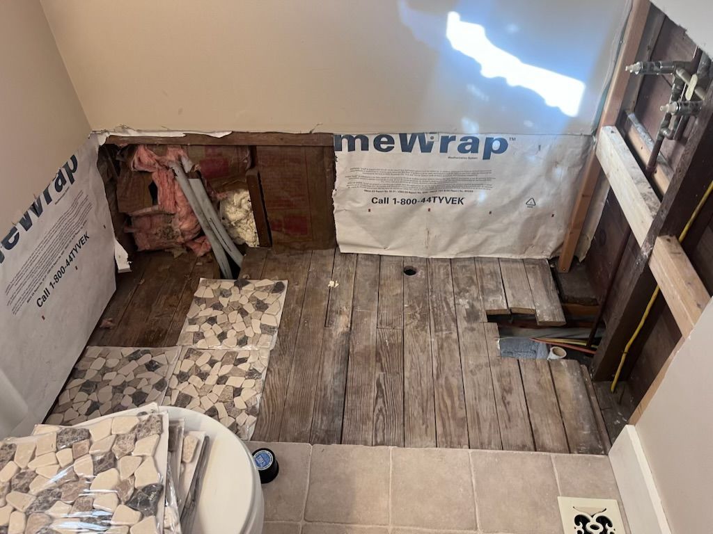 A bathtub is sitting in a bathroom under construction.