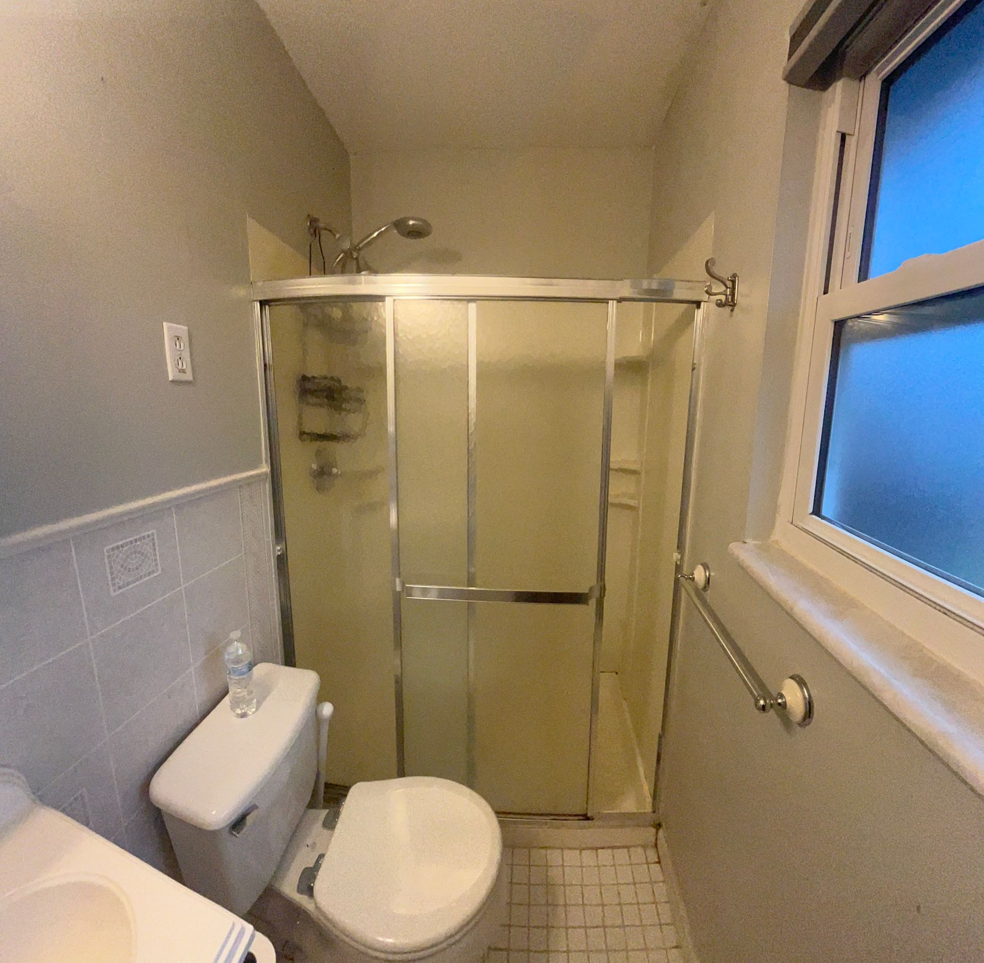 A bathtub is sitting in a bathroom under construction.